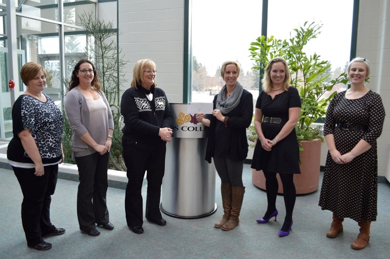 On Dec. 11 at the Land Sciences Centre Atrium, RBC Royal Bank in Olds presented a $10,000 cheque to Olds College to institute &#8220;BreathingRoom,&#8221; an online program