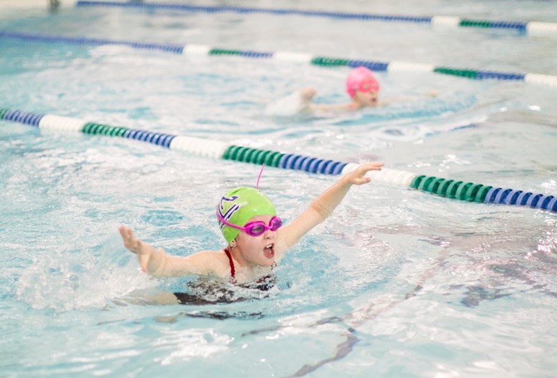 Rauri Slimmon swims down her lane using the butterfly stroke during an Olds Rapids Swim Club fun meet at the Olds Aquatic Centre on Dec. 10.