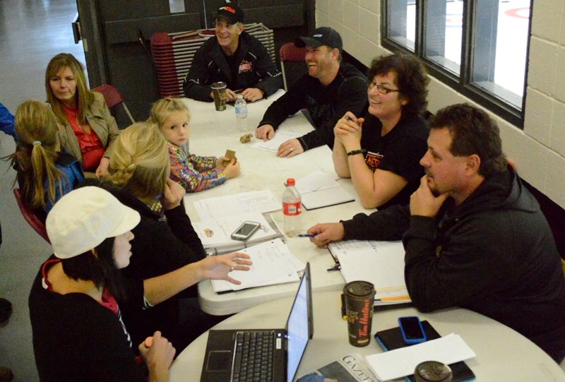 Members of a committee hoping to land the 2015 peewee AA major provincials hockey tournament meet at the Olds Sportsplex on Oct. 23.