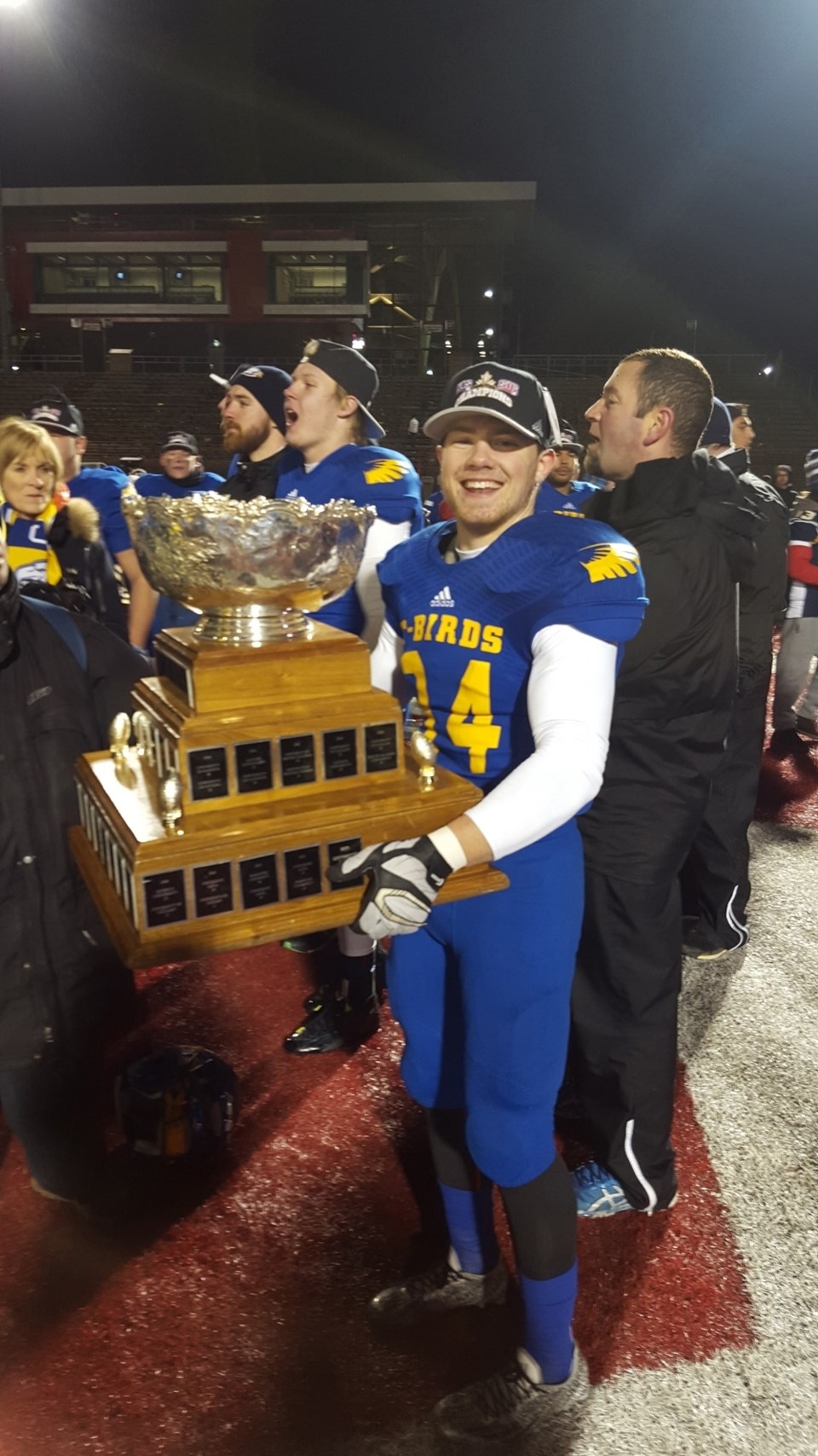 Former Olds resident DJ Neustaeter holds the Vanier Cup after his new team, the UBC Thunderbirds, won the Canadian university football championship 26-23 over the Montreal