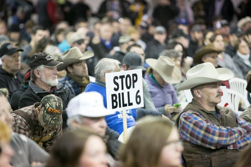 A packed house takes in a government information session on Bill 6 at the Cow Palace in Olds on Dec. 9.