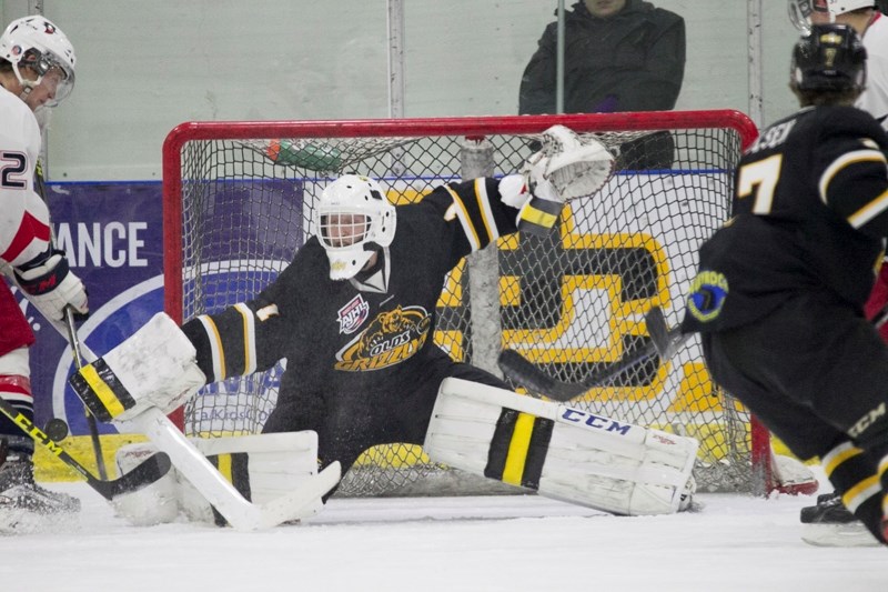Olds Grizzlys goaltender Kurtis Chapman makes a save during the Grizzlys&#8217; game against the Brooks Bandits at the Olds Sportsplex on Jan. 2.