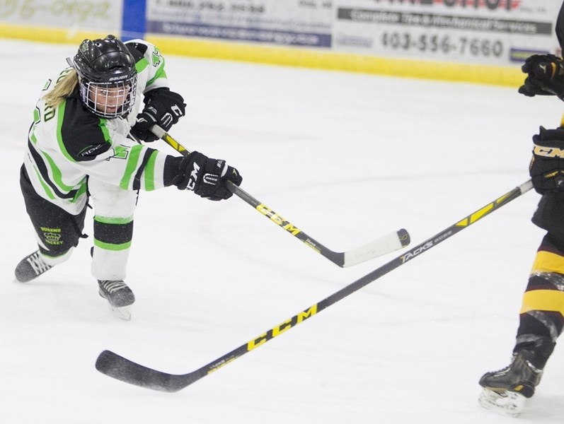 Red Deer College Queens player Rikki Leonard attempts a shot during the Queens&#8217; game against the Olds College Broncos at the Olds Sportsplex on Jan. 14.