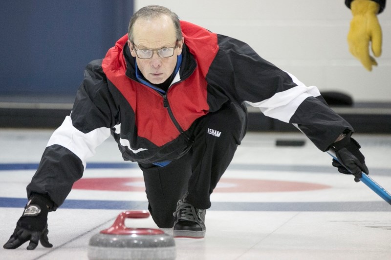 Jim Dunlop releases a rock during the Seniors Bonspiel at the Olds Curling Club on Jan. 15.