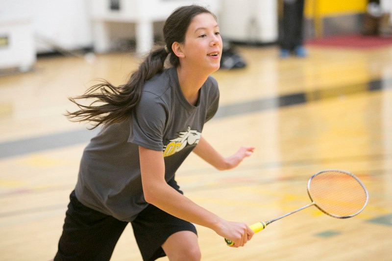 Olds High School student Faith Walton plays a singles match during an Olds College badminton practice at Frank Grisdale Hall.