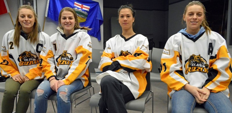 Players on Olds Midget A female hockey team. From left, Dayna Leonard, Kiera Davidson, Janelle Graham and Kelly Leonard. The players visited the town office on Jan. 25 as