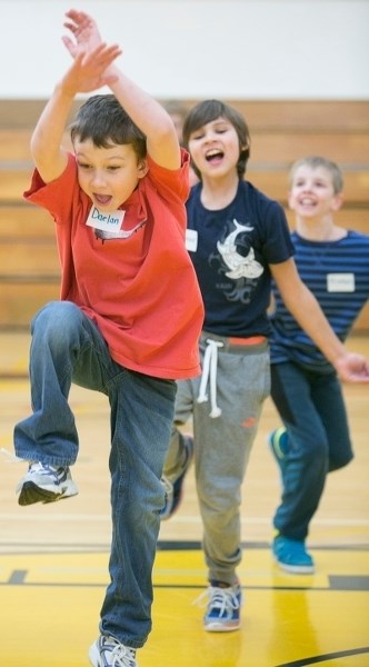 Tri-Active program member Daelan Sahli runs through a warm-up drill during a session at Frank Grisdale Hall.