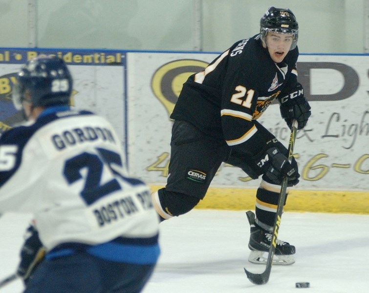 Jeremy Klessens crosses the blue-line against the Canmore Eagles on Feb. 6 at the Olds Sportsplex. The Grizzlys lost the game 6-4.