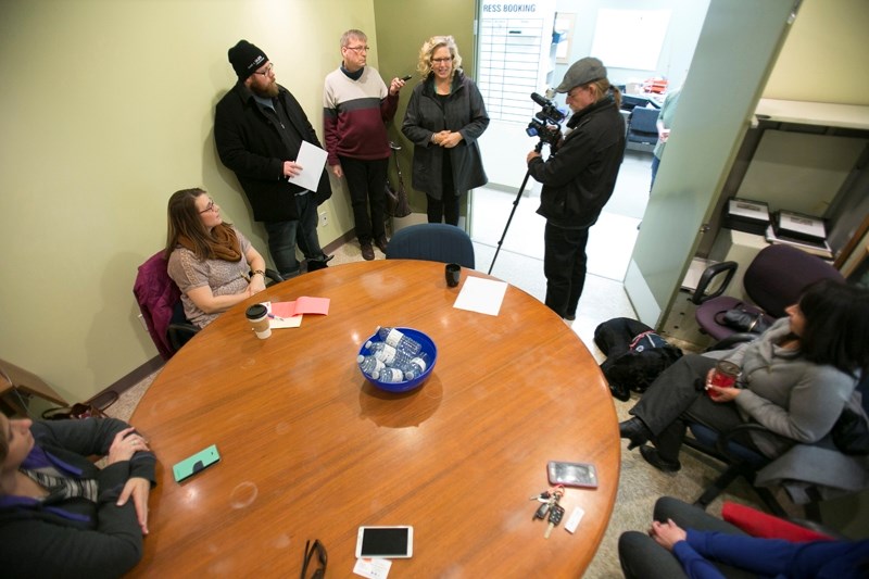 Spring Fling organizing committee co-chair Tracy Gardner discusses the April 7 event with news media and representatives of the four charities/causes chosen to split the
