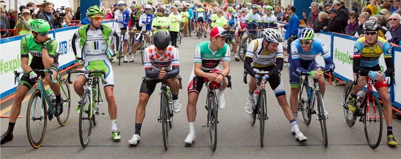 Riders share a light moment just before starting from Innisfail during the 2014 Tour of Alberta.