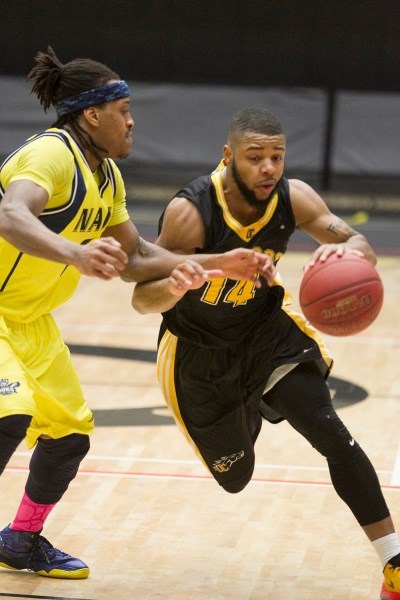 Olds College Broncos player Wayne Tucker Jr. drives the lane during the Broncos&#8217; game against the NAIT Ooks at Olds College on March. 3. The game was part of the ACAC