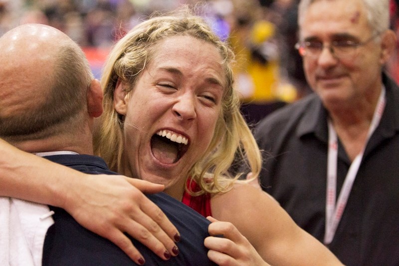 Olds resident Danielle Lappage hugs coach Dave McKay after defeating Braxton Stone in their second match to secure a spot on the Canadian Olympic team next year in Rio.