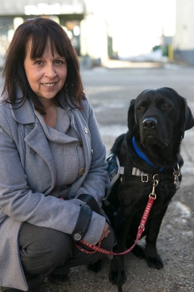 Chinook Arch Victim Services program manager Rhonda Kearns with compassion dog Ringo.