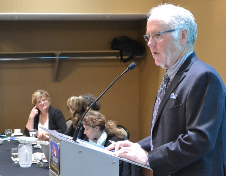 Mountain View Credit Union chair Charlie van Arnam addresses the crowd during the institution&#8217;s annual general meeting March 21 at the Pomeroy Inn &#038; Suites.