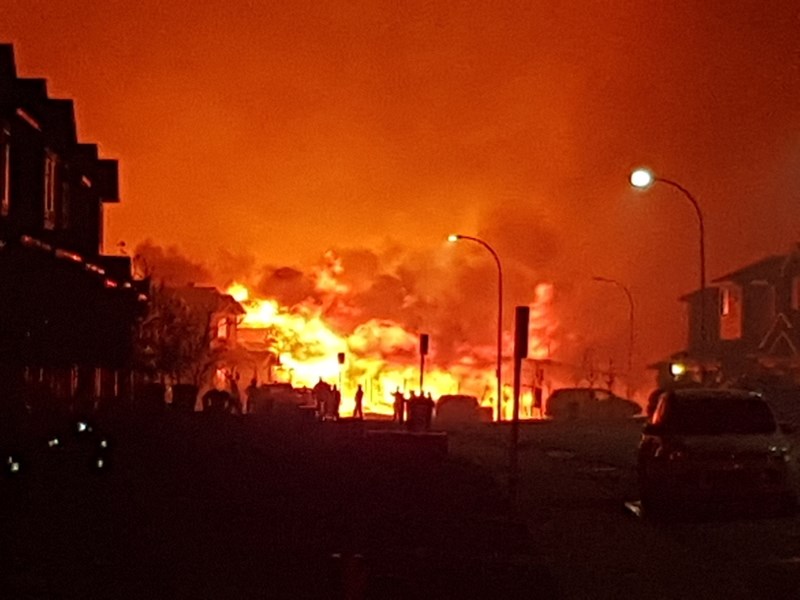 Flames light up the sky in Fort McMurray.
