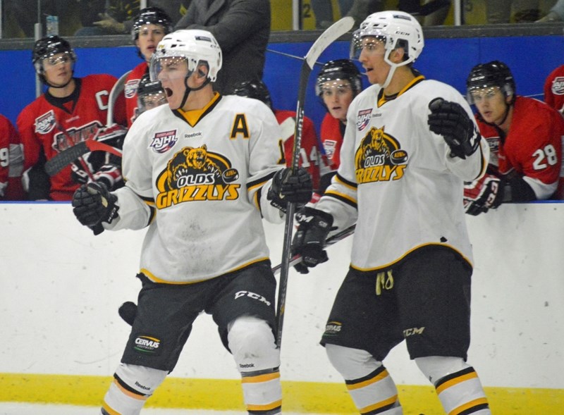Grizzlys forward Landon Kletke, left, celebrates a goal during this season&#8217;s homeopener. The longtime forward will play for the Red Deer College Kings in the ACAC next