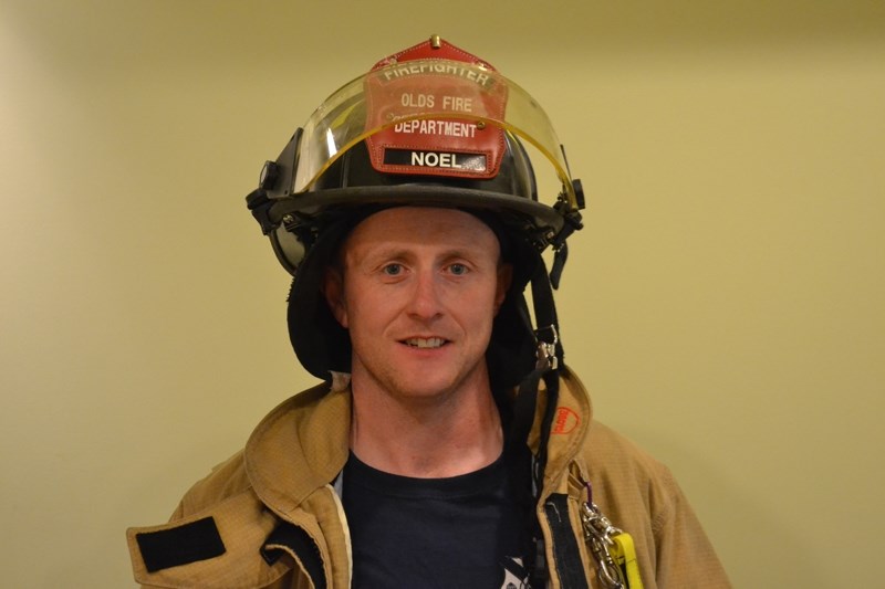 Olds firefighter Noel Darcy ran in the Calgary Marathon this past Sunday, hoping to set a world record for running a marathon in full firefighter gear.