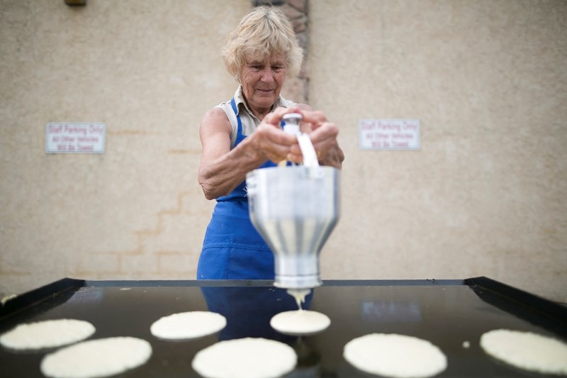 Anne Burchill makes pancakes during a pancake breakfast put on by the Olds Hospital and Care Centre at the Olds Legion on June 8.