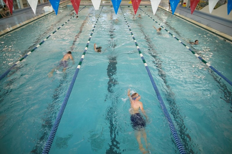 Students swim laps at the Olds Aquatic Centre during Deer Meadow School&#8217;s triathlon on June 22