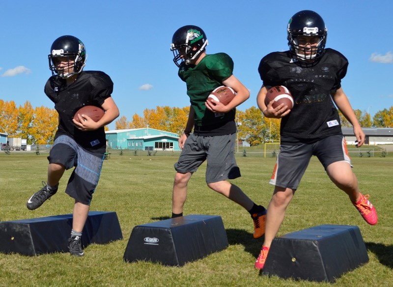 Football players at Bowden Grandview School perform an agility drill in practice on Sept. 15. The Blazers are starting their second season.