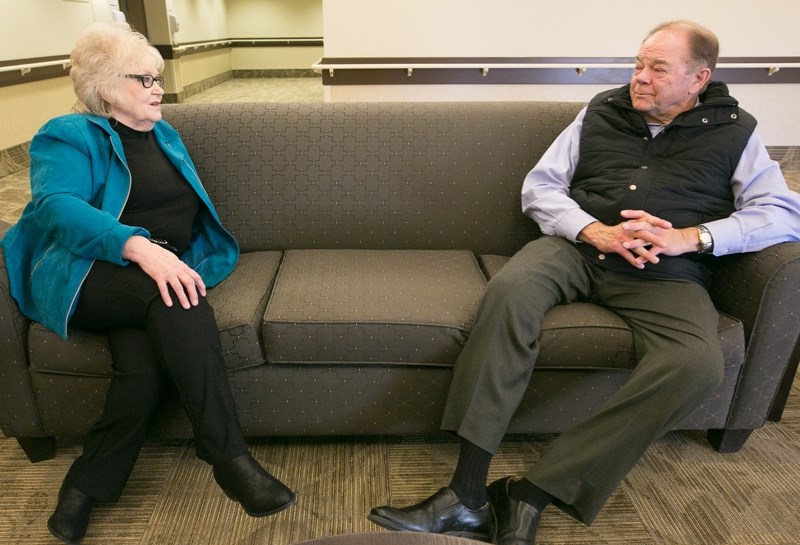 Andrea Hawiuk speaks with Darrel Janz at the hospice suites at the Sunrise Village Olds Encore facility on Oct. 12.