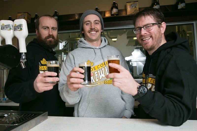 Olds College students from left Carson Petersen, Dan Lake and Curtis Metzger toast their success at the Olds College Brewery.