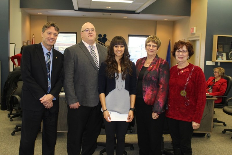 Olds High School graduate Janine Nel, third from left, poses with the scholarship she received Dec. 14, surrounded by Chinook&#8217;s Edge School Division (CESD) board