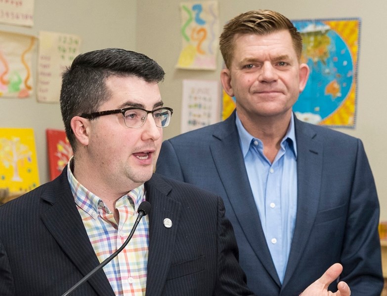 Wildrose Party leader Brian Jean looks on as Olds-Didsbury-Three Hills MLA Nathan Cooper makes a point. Cooper says Jean will be at the Legion in Olds Monday, Feb. 27 at 7