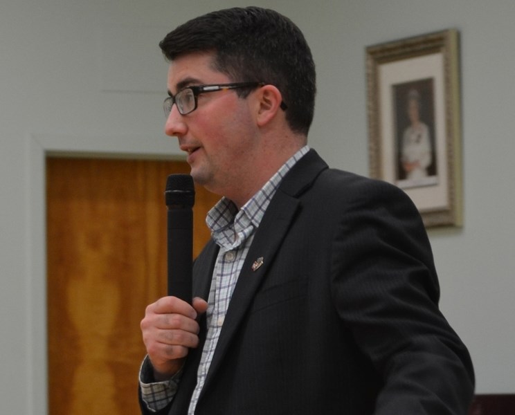 Olds-Didsbury-Three Hills MLA Nathan Cooper addresses the crowd at his town hall meeting in Olds.