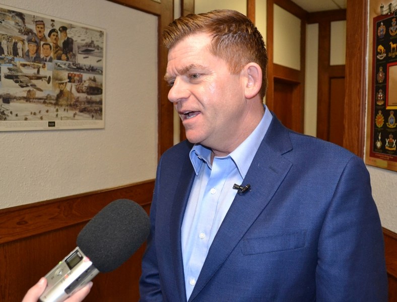 Wildrose Leader Brian Jean speaks to the news media during a meeting at the Legion in Olds on Feb. 27.
