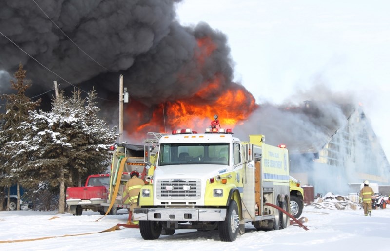 Firefighters &#8211; including those from the town of Olds &#8211; battle devastating fire that broke out in a barn just north of Olds Thursday afternoon, destroying a