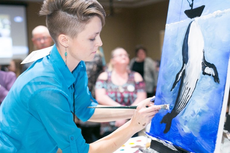 Carlie Marsh, this year&#8217;s winner, works on her painting during the second round.