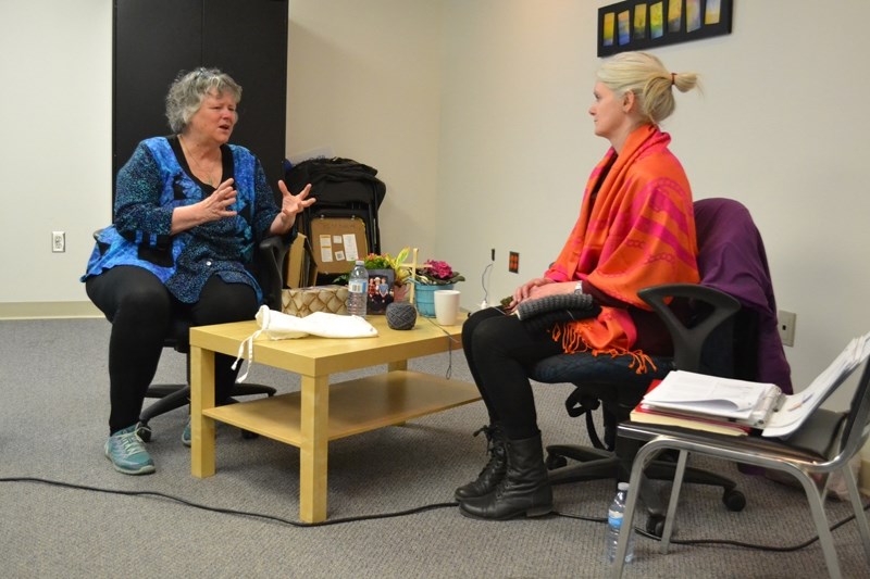 During NCARE training at the Peaks to Prairies building, Brenda Hooper (left) and Kelly Sullivan do a bit of role playing. Hooper plays a navigator who has come to visit