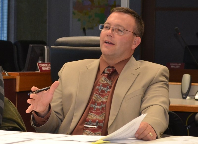 Chief operating officer Doug Wagstaff speaks during an Uptowne Olds meeting.