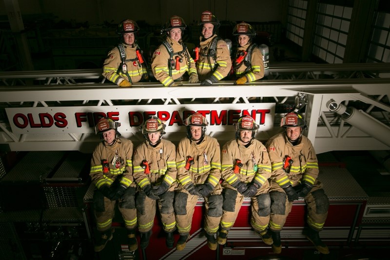 Olds firefighters, top row from left, Taylor Jacobsen, Ciaran Boggan, Josh Watkins and Sara Durocher and bottom row from left, Noel Darcy, Casey Bateman, Sty Didyk, Pete
