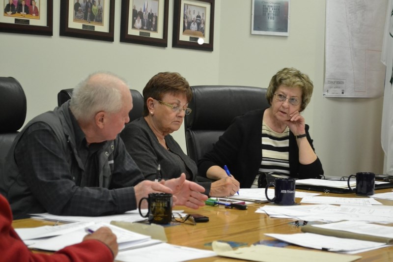 Bowden town councillor Wayne Milaney (far left) discusses impending construction of a new community hall in the town with fellow councillors Sandy Gamble (middle) and Sheila