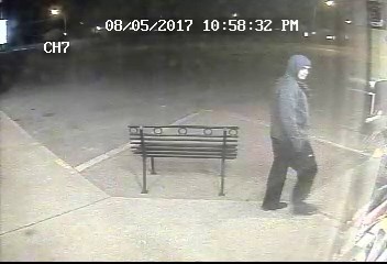 This photo shows the armed robbery suspect about to enter Rocky Mountain Liquor.