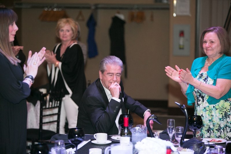 Family members and the crowd gave a standing ovation to outgoing Olds College president Tom Thompson during an evening at the Pomeroy Inn &#038; Suites on May 18 celebrating