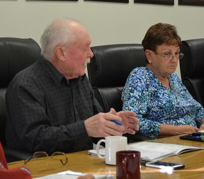 Bowden councillor Wayne Milaney, left, suggests contacting Olds College about providing information to town staff on tree care. Looking on is Coun. Sandy Gamble.