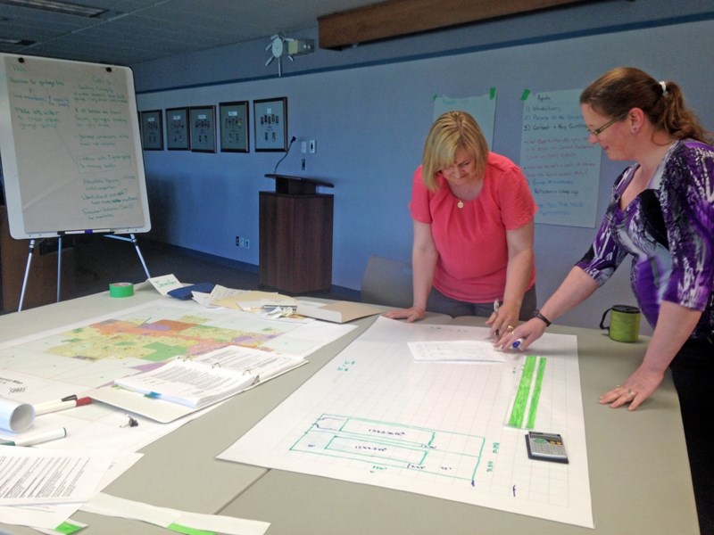 Municipal planner Kimberly Soutiere, right, and community facilitator Jennifer Lutz ran two public meetings June 1 to gauge public opinion on a proposal to allow narrow