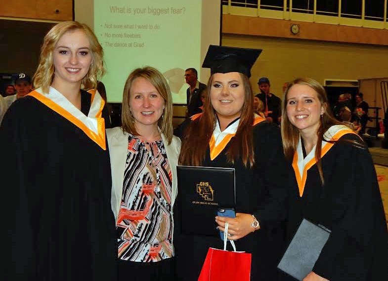 Olds High School&#8217;s first group of French Immersion grads: from left, Stacia Powell, French teacher Melanie Hillier, Abbey Iverson and Rene Trombley.