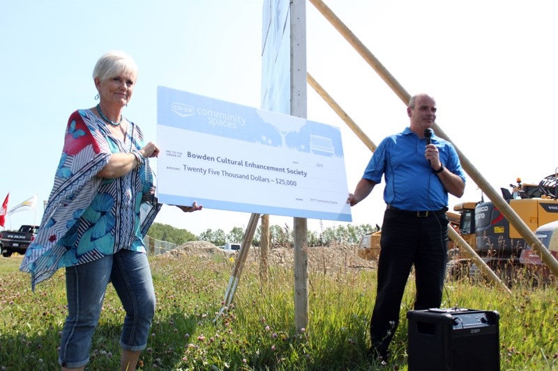 Dennis Lang, general manager of the Westview Co-op, right, presented a cheque for $25,000 from the Co-op Community Spaces program to Mabel Hamilton, president of the Bowden