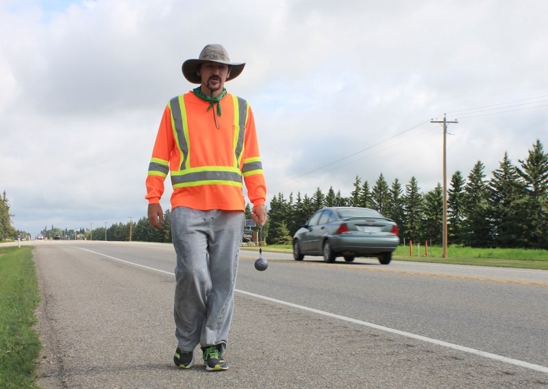 Mike Loughman made his way through Olds last Friday (Aug.4), on the tail-end of a 1,000-km march from High Level, Alta. to Airdrie, to raise money and awareness for mental