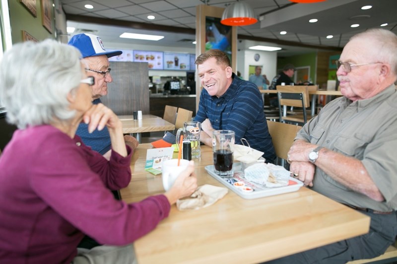 United Conservative Party leadership candidate Brian Jean visits with people at A&#038;W in Olds on Aug. 17.