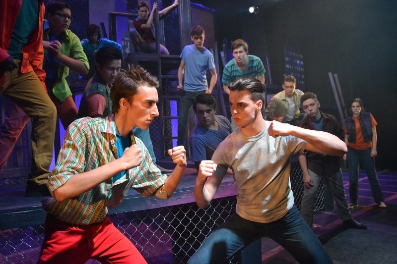 OHS grad Ryan Maschke, right, faces off against his stage double Ethan Taylor during a rehearsal of StoryBook Theatre&#8217;s West Side Story. The pair were double-cast for
