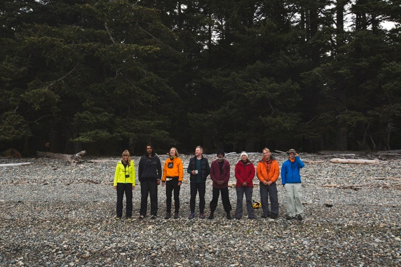 Artists in the short film Eyes of Society pose on the beach.