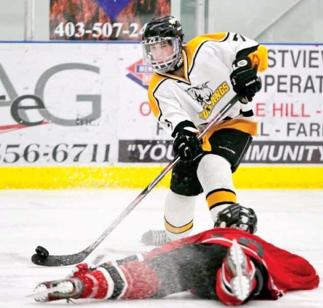 Olds Midget Mustangs player Colton Weseen gets in a scoring attempt during the Mustangs&#8217; game against the Sundre Midget team at the Olds Sportsplex last Saturday. The
