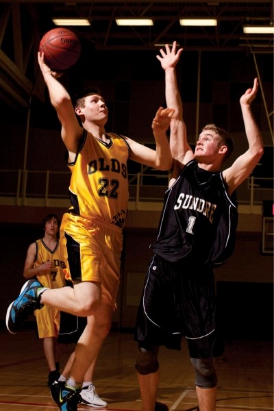 Olds High School Spartans player Riley Challick goes up for a layup during the Spartans&#8217; game against the Sundre Scorpions at the Ralph Klein Centre in Olds last Friday.