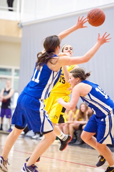 Olds College Broncos varsity women&#8217;s player Mackenzie Srorenski-Fyfe makes a pass during the Broncos&#8217; game against the St. Mary&#8217;s University College