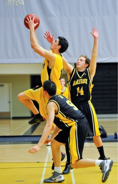 Mitch Smith goes for two as the Broncos take on the Ambrose Lions in ACAL basketball action at the Ralph Klein Centre on Friday night.